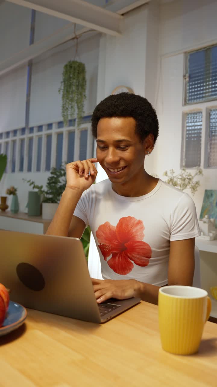 Man working on laptop at home