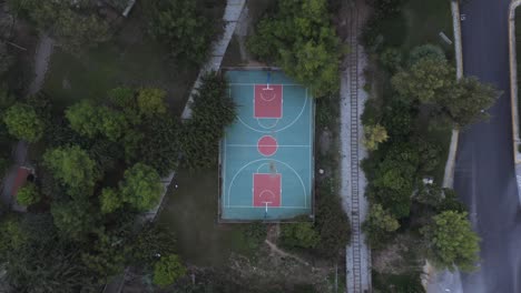 A-birds-eye-view-of-an-outdoors-basketball-court-in-Athens,-Greece-without-any-people