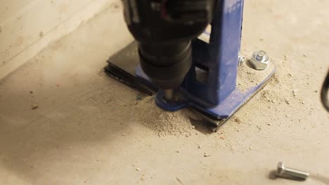 builder drilling concrete floor