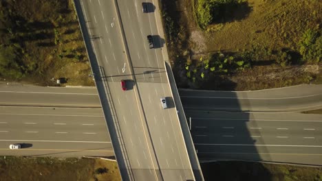 birds eye view following traffic on a highway overpass