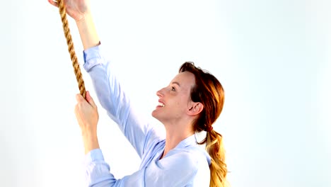 woman pulling a rope against white background 4k