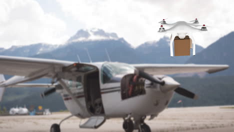 drone carrying a box in front of an airplane