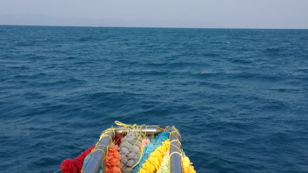 The nose of the ship on the waves among the blue sea