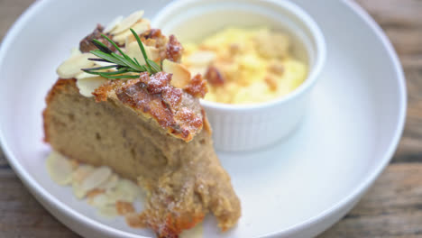 banana cake with cream cheese and crumble on plate