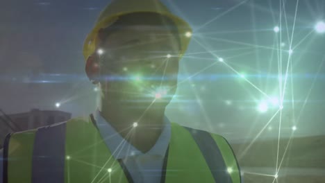 animation of network of connections with light spots over caucasian male worker