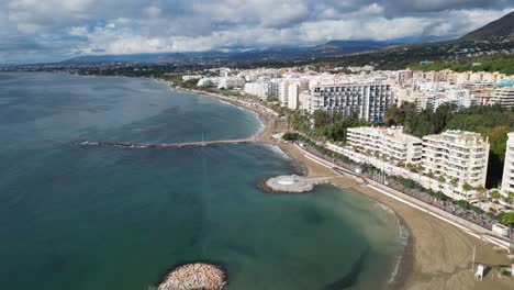 Marbella-Boulevard-and-Coastline-with-Luxury-Hotels-in-Andalusia,-Spain---Aerial