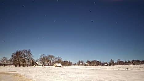 Cirrus-clouds-disappear-while-starts-are-moving-above-a-winter-landscape