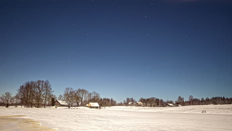 cirrus clouds disappear while starts are moving above a winter landscape