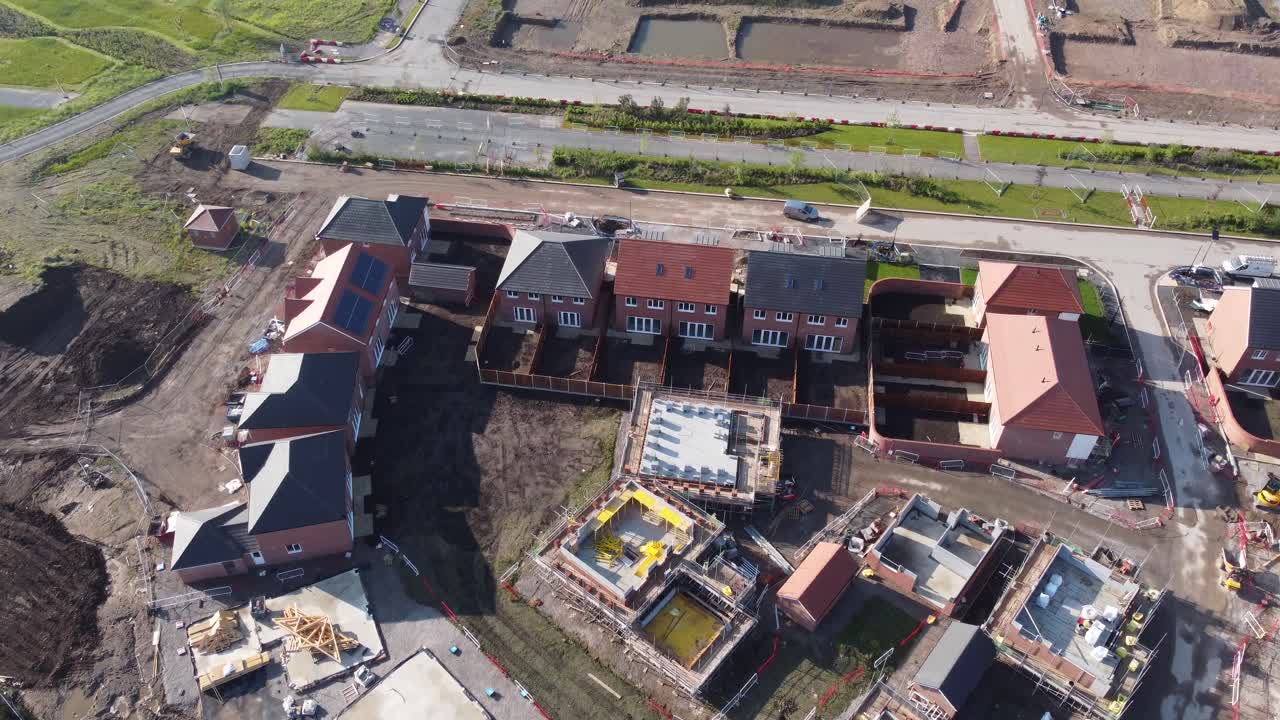 Drone aerial view of house building site in Cheshire, England, UK, Europe, illustrating urban development due to housing shortage in the UK.