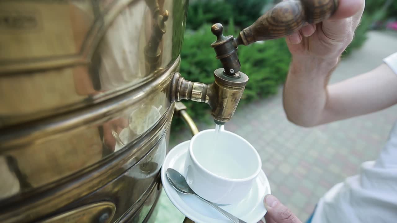 Russian Tea Samovar. Tea party with a samovar in the garden