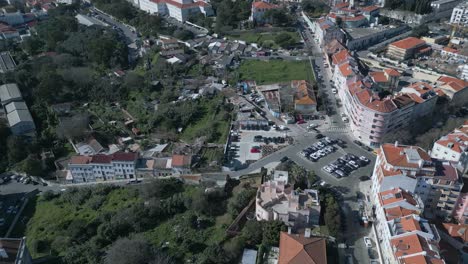 aerial view over residential area with car road traffic and red rooftops buildings