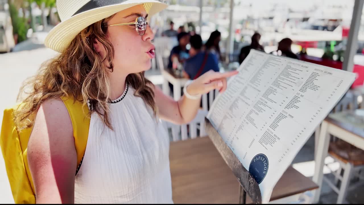 Athens Waterfront Dining: Young Woman with Menu