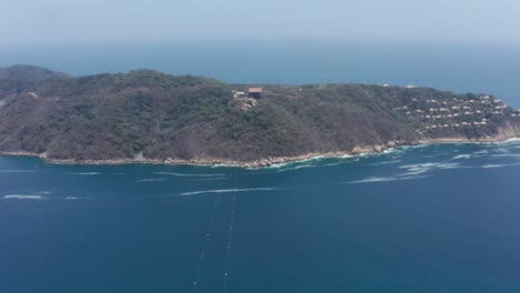 aerial view on zipline cables and cape with landing zone, acapulco mexico