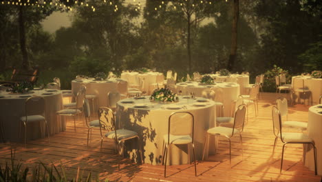 mesa y silla de mimbre vacías en el jardín forestal del restaurante al aire libre