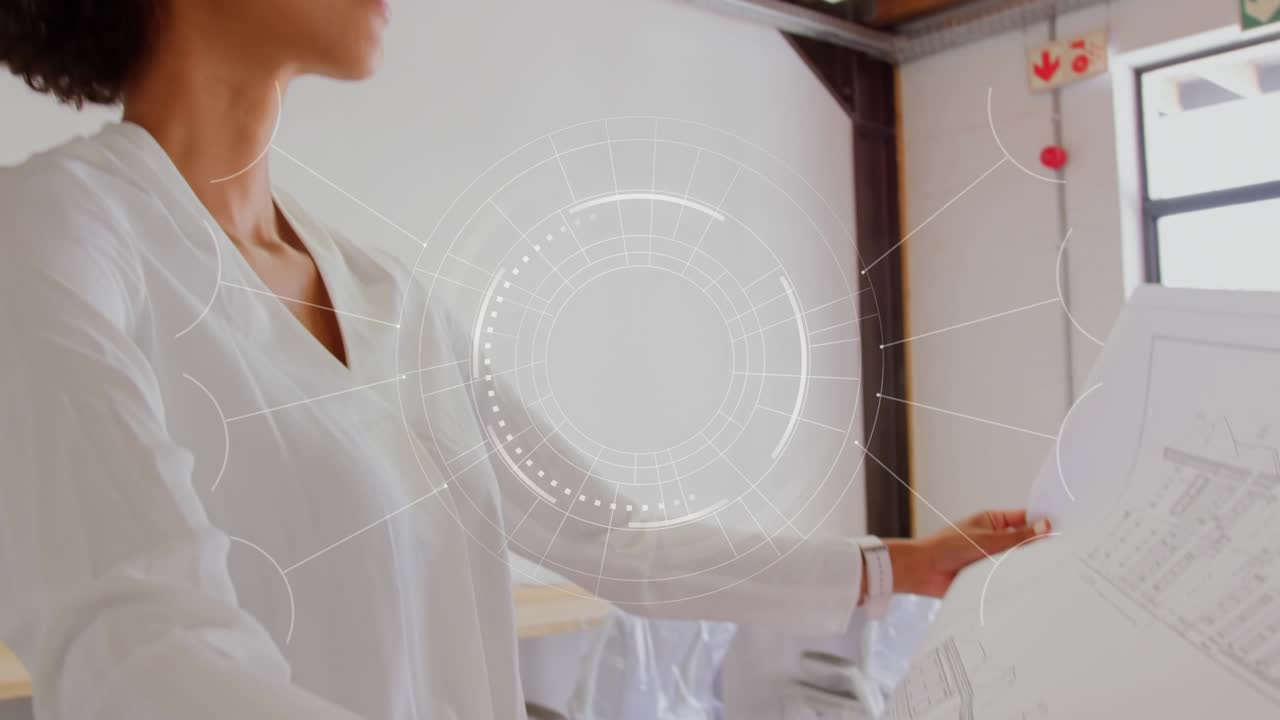 Woman architect unfolding large plans and comparing to loft studio while HUD overlaying details