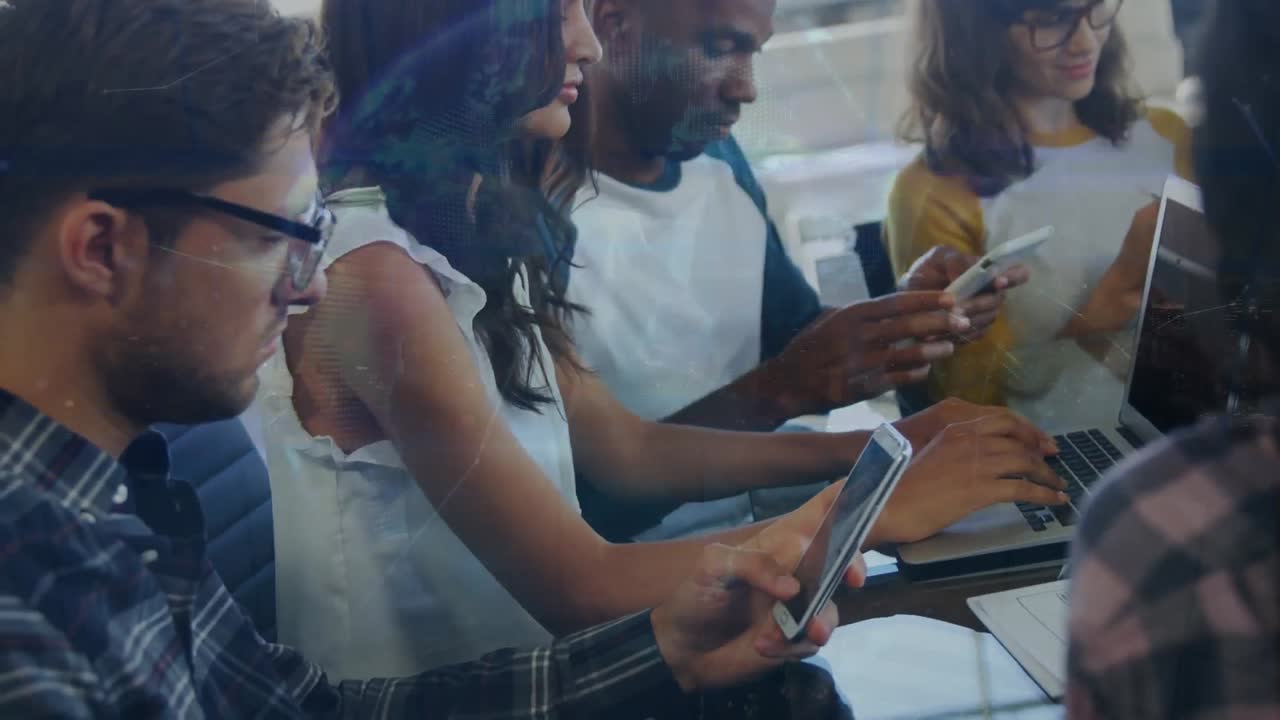 Animation of globe of connections over diverse business people using tablets