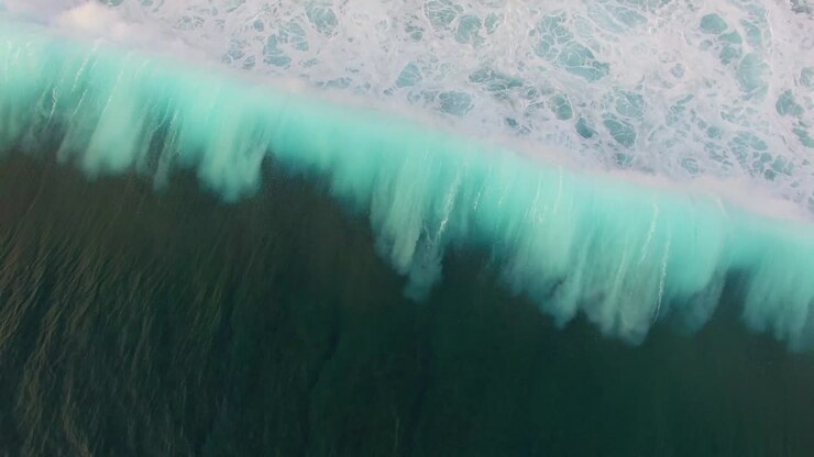 Blue Waves Breaking Over Reef