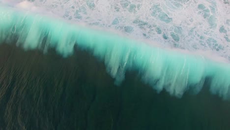 blue waves breaking over reef