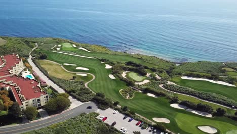 aerial view of trump nation golf club in rancho palos verdes, los angeles, california with the pacific ocean in the background on a warm, sunny day with perfect fairways