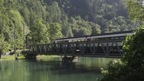 train passing bridge over river aare