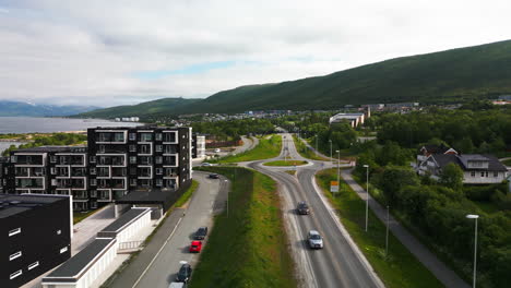 drone flight along e8 road next to fjord in tromso, norway