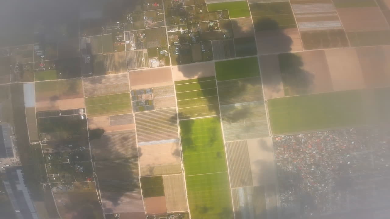 Inside the white cloudscape. Flying through the cloud to reveal the view of the inhabited landscape. FPV drone footage.