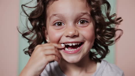 happy young girl smiling with a missing front tooth