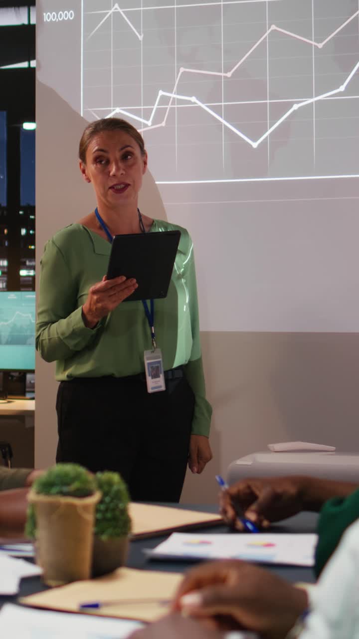 Vertical Video Corporate employees exchanging project details and essential information