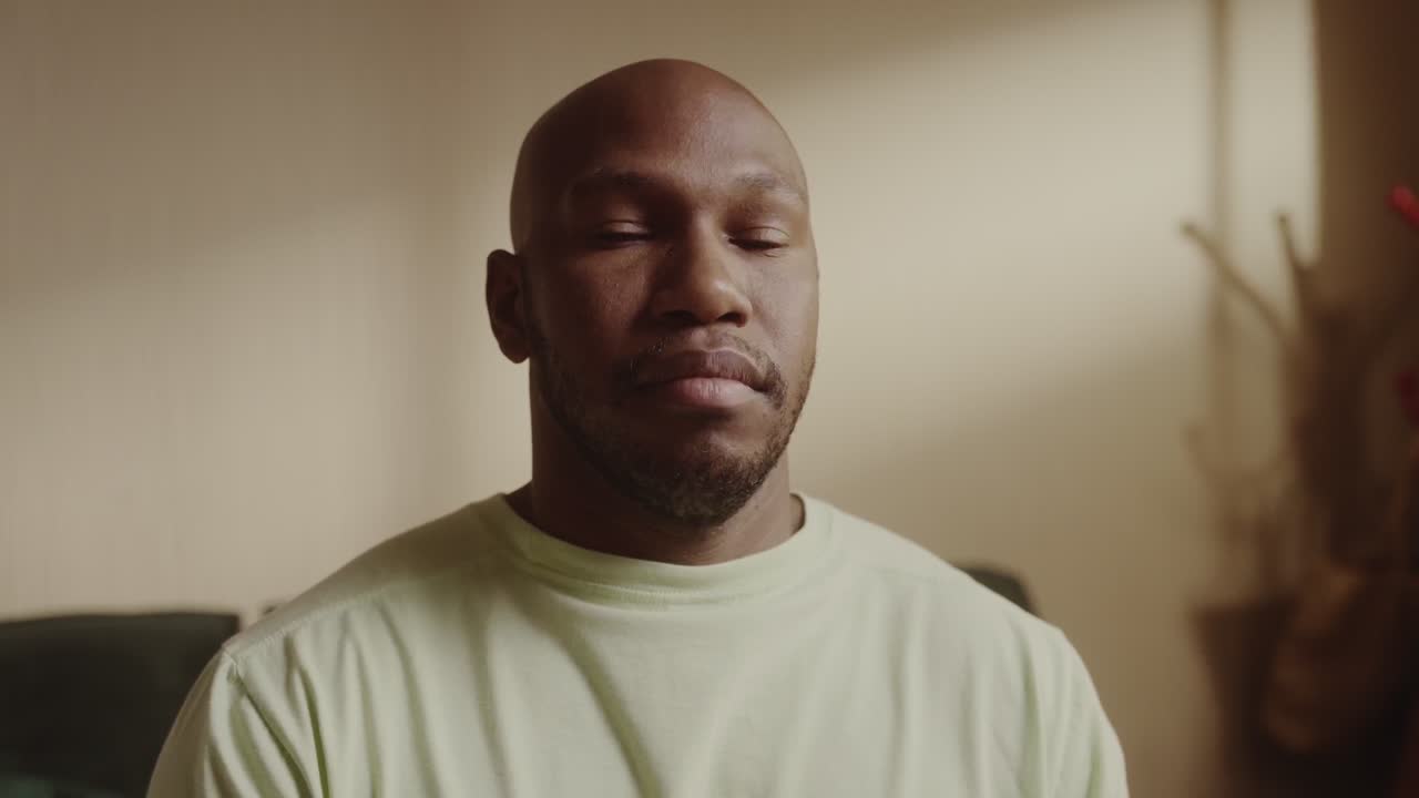Close-up portrait of a thoughtful Black man
