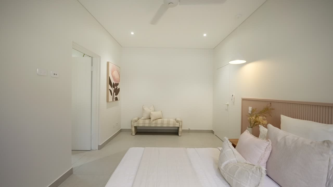 Cozy modern bedroom with sleek furnishings and soft lighting in a luxury small home. Interior of house home staged for real estate.