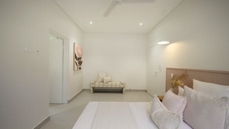 cozy modern bedroom with sleek furnishings and soft lighting in a luxury small home. interior of house home staged for real estate.