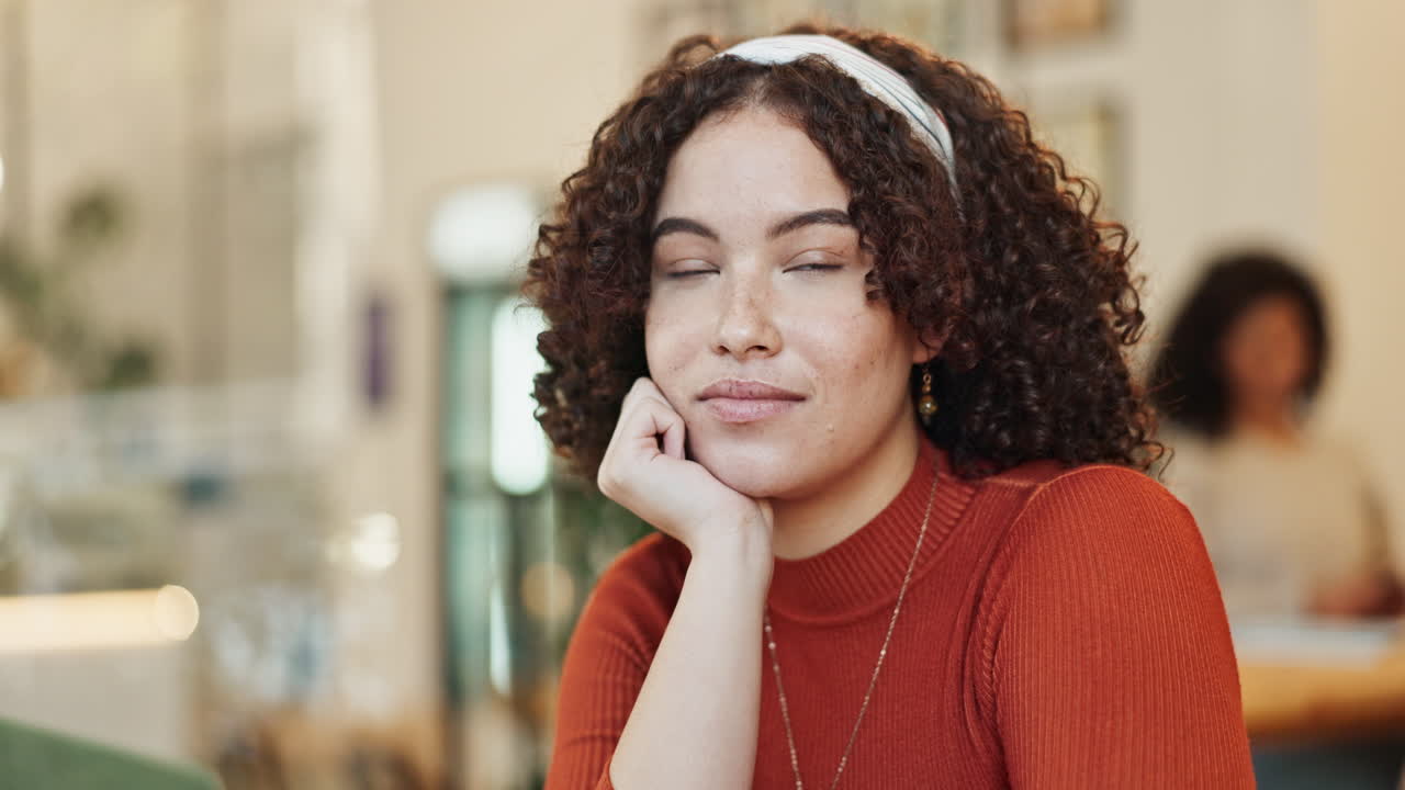 Portrait of a thoughtful woman in a cafe