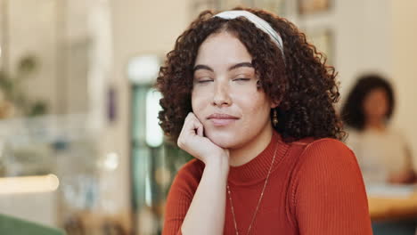 portrait of a thoughtful woman in a cafe