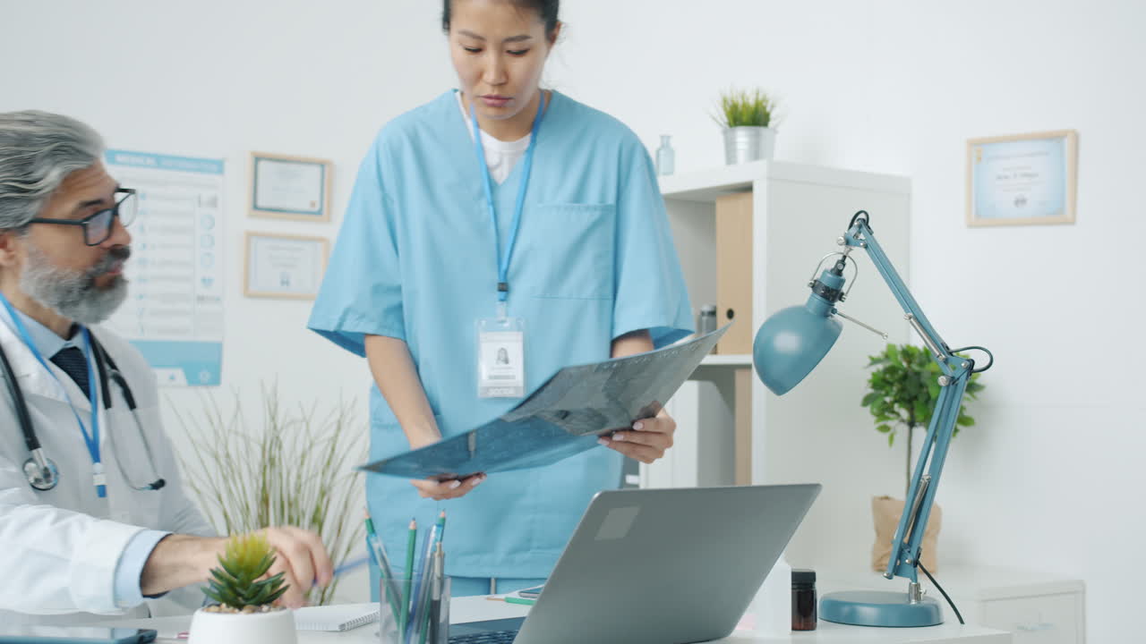 Doctor and Nurse Reviewing X-Ray