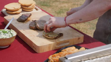 Piece of meat being sliced into pieces with a sharp knife