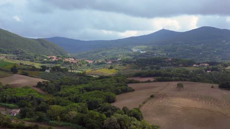 Fantastic-aerial-top-view-flight-Tuscany-meditative-valley,-village-Italy-fall-23