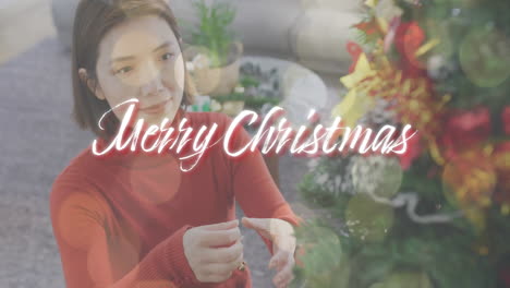 decorating christmas tree, woman with merry christmas text animation