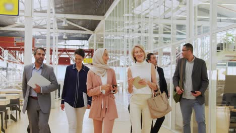 Business-people-talking-and-walking-in-a-conference-foyer