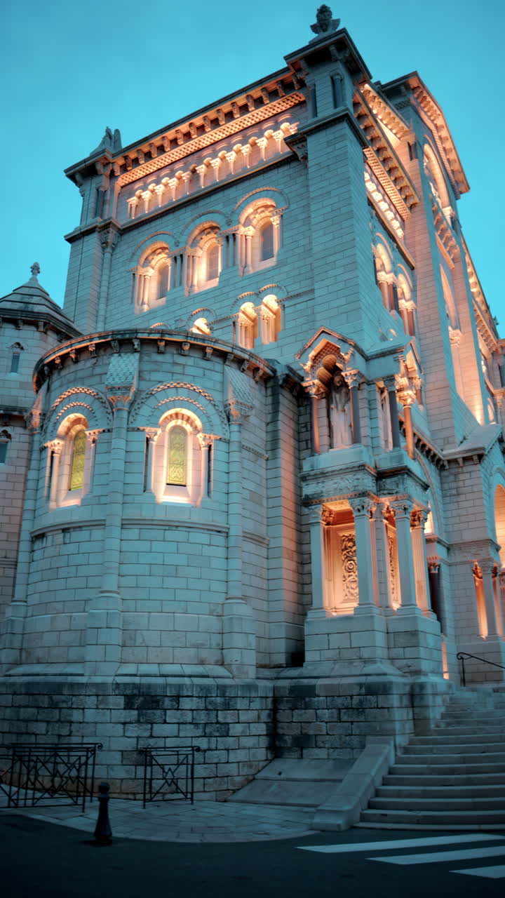 Monaco City, Monaco - September 4, 2024: The facade of the Monaco Cathedral in the Old Town in the evening. Vertical