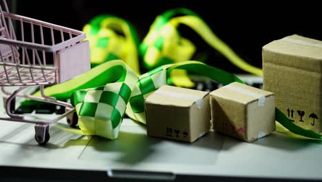 ramadan promotion -small shopping cart with cardboard box and ribbon ketupat