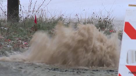 WATER-MAIN-PIPE-BURST-BREAK-THROUGH-ROAD