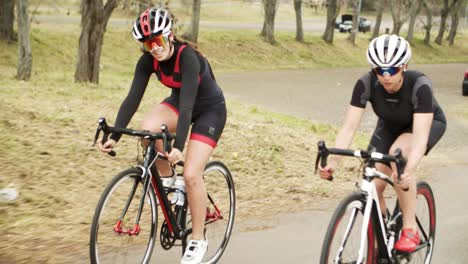 group of focused people riding bicycles