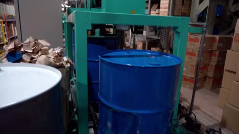 The-production-line-utilizes-a-conveyor-system-to-move-steel-drum-cans-for-subsequent-operations