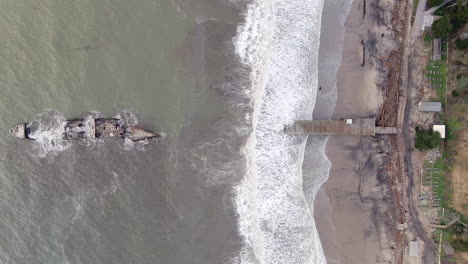 severe damage at seacliff pier, california caused by storms in january 2023 - straight down aerial view