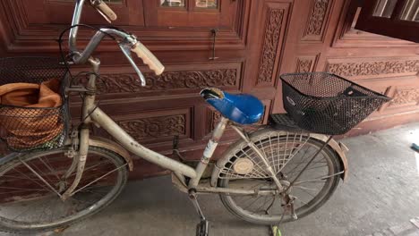 bicycle gradually adorned with wicker art