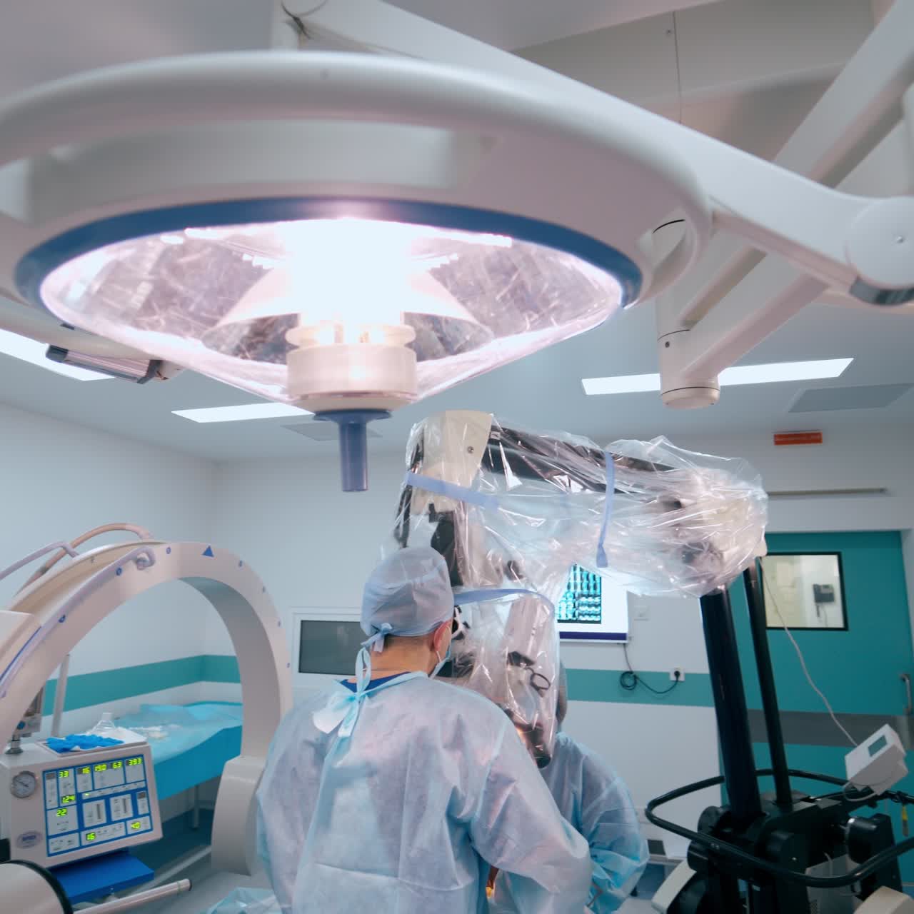 Neurosurgery in contemporary operating theater. Professional doctors perform an operation using microscope. Neurosurgical department.