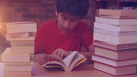 animation of light trails over biracial boy reading books