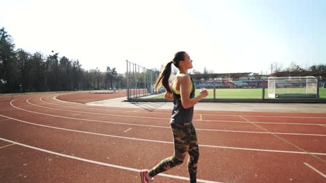 Athletic woman running on track, healthy fitness lifestyle