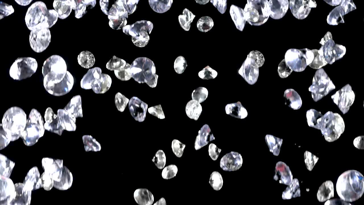 어두운 배경 위에 천천히 떨어지는 다이아몬드 끝없는