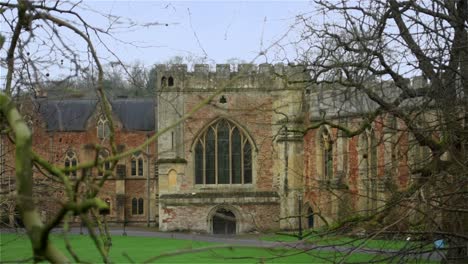 looking towards the impressive edifice of the medieval bishop's palace, a beautully preserved castle in the city of wells in england